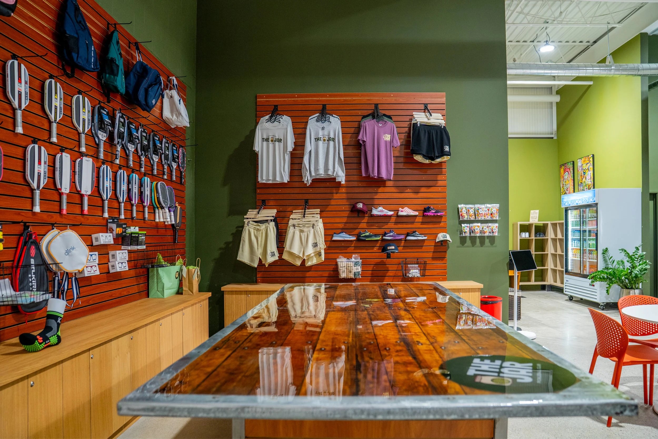 Paddles, shoes and apparel in the pro shop at The Jar Pickleball Club